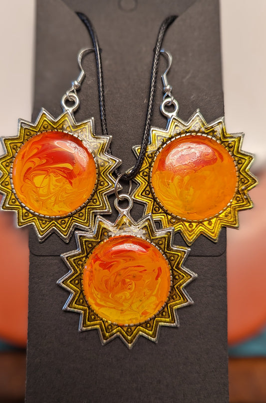 Pendentif et boucles d'oreilles soleil